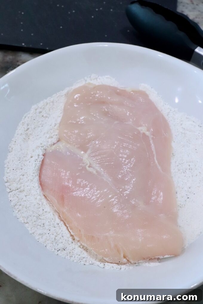 Crispy Parmesan-Crusted Chicken Recipe 6 chicken breast in a bowl of flour