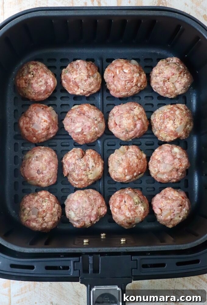 Crispy, Juicy Air Fryer Meatballs Recipe 6 raw meatballs in air fryer basket