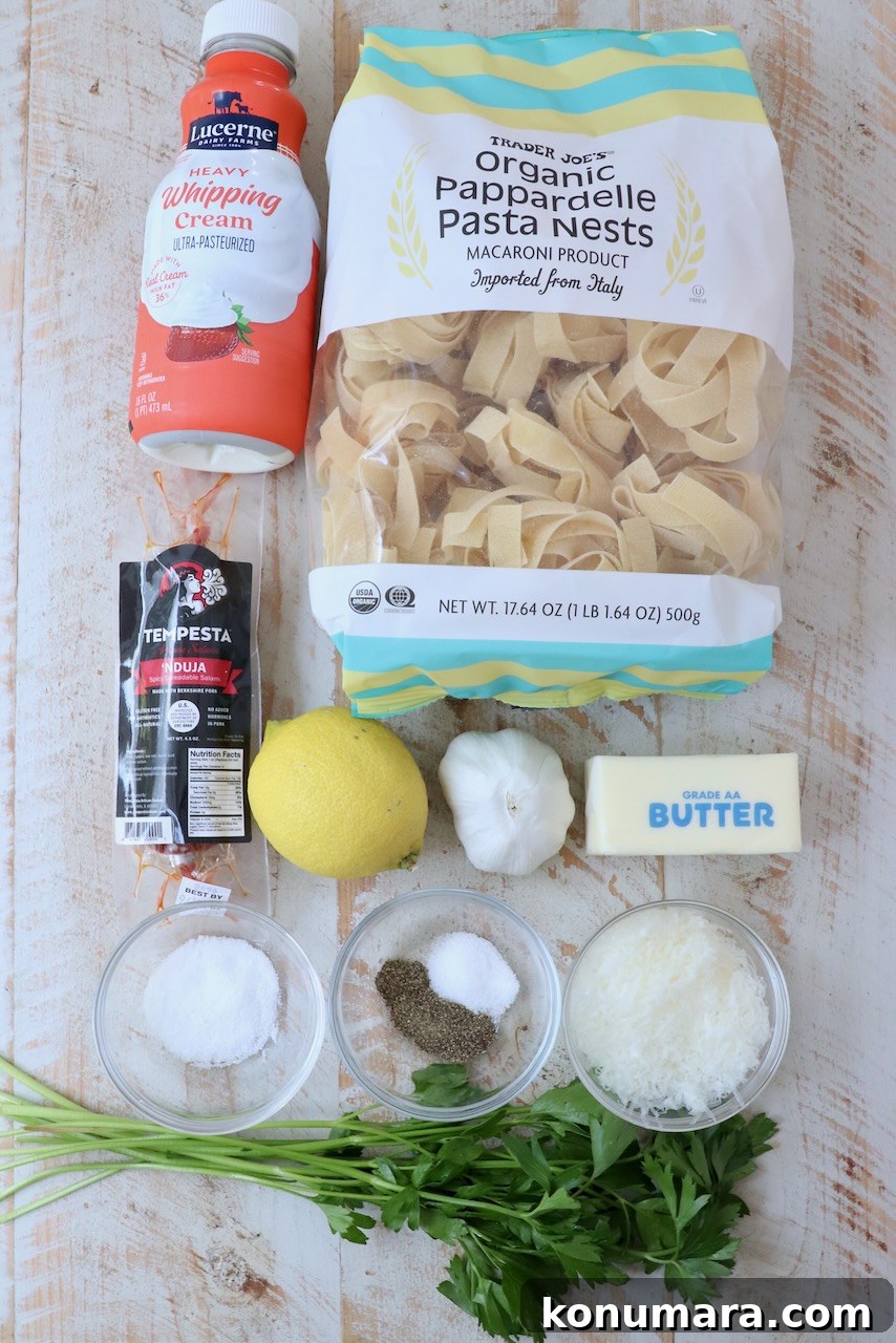 Spicy Nduja Pasta Recipe with Cherry Tomatoes 3 ingredients for nduja pasta on white wood board