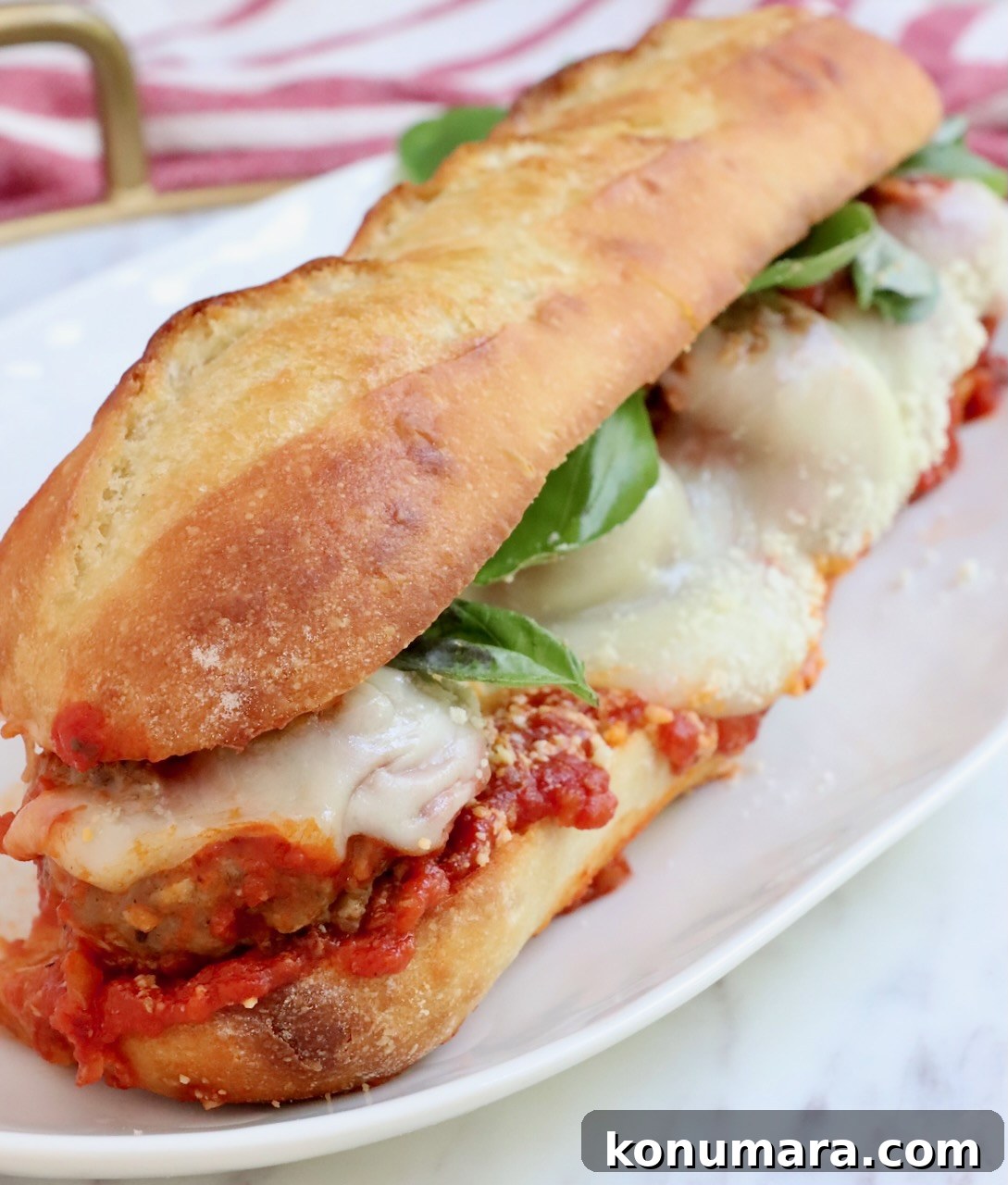 Classic Meatball Sub Recipe with Marinara and Mozzarella 11 meatball sub on plate