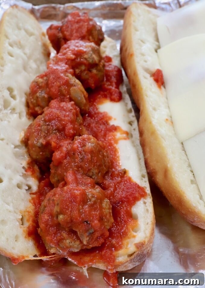 Classic Meatball Sub Recipe with Marinara and Mozzarella 8 meatballs tossed in marinara sauce in a baguette with melted mozzarella cheese
