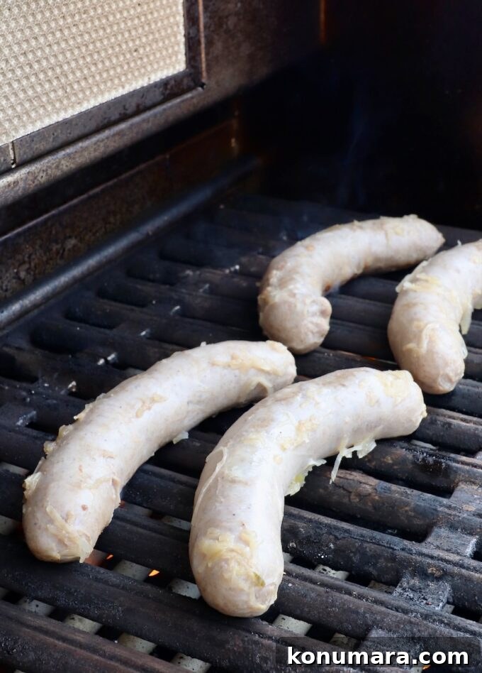 Smoky Grilled Bratwurst with Caramelized Onions 6 bratwurst on grill