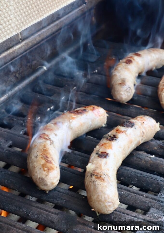 Smoky Grilled Bratwurst with Caramelized Onions 7 grilled bratwurst on grill