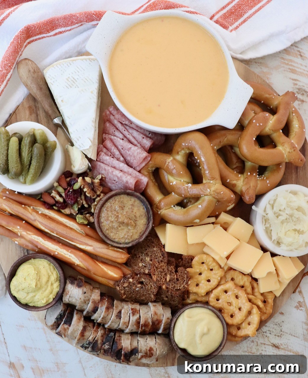 Oktoberfest Charcuterie Board: German Meats and Beer Pairings 7 Oktoberfest charcuterie board filled with cheese, meats and pretzels