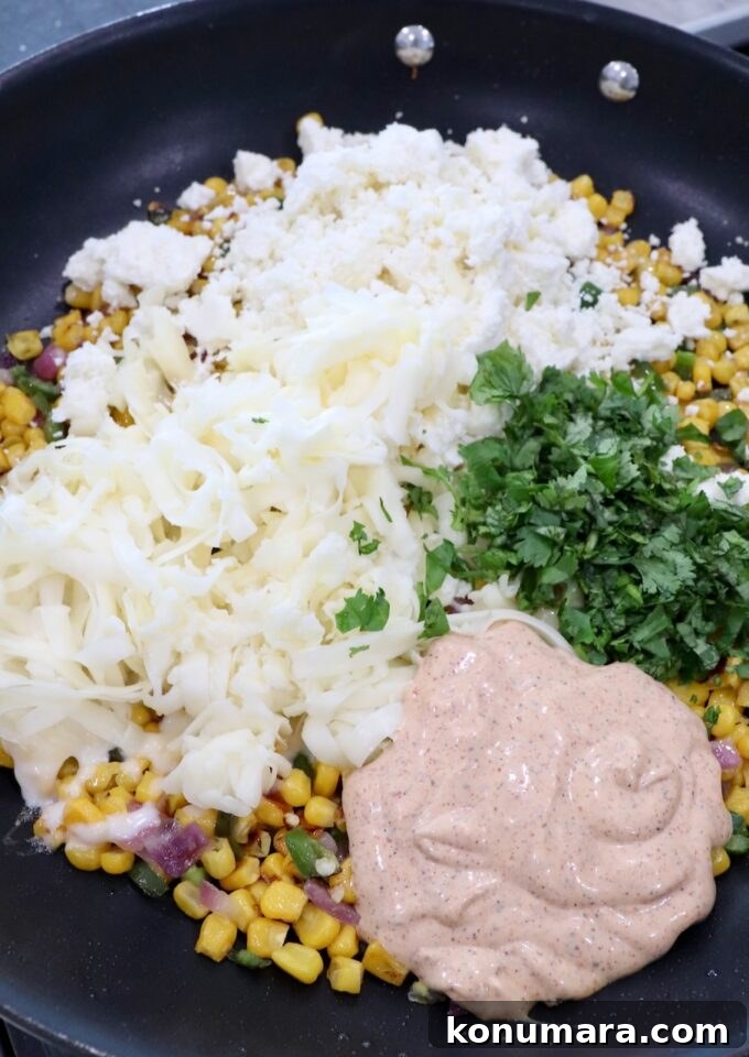 corn kernels, diced onions and jalapenos in a skillet with chili lime dressing, cilantro and cheese