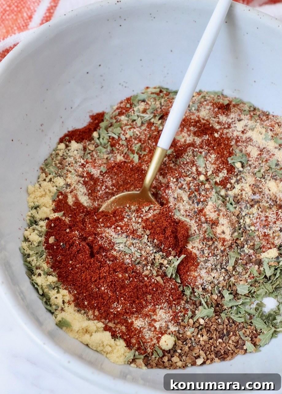 Citrus-Herb Salmon Seasoning for Grilling and Baking 2 salmon seasoning in bowl with a spoon