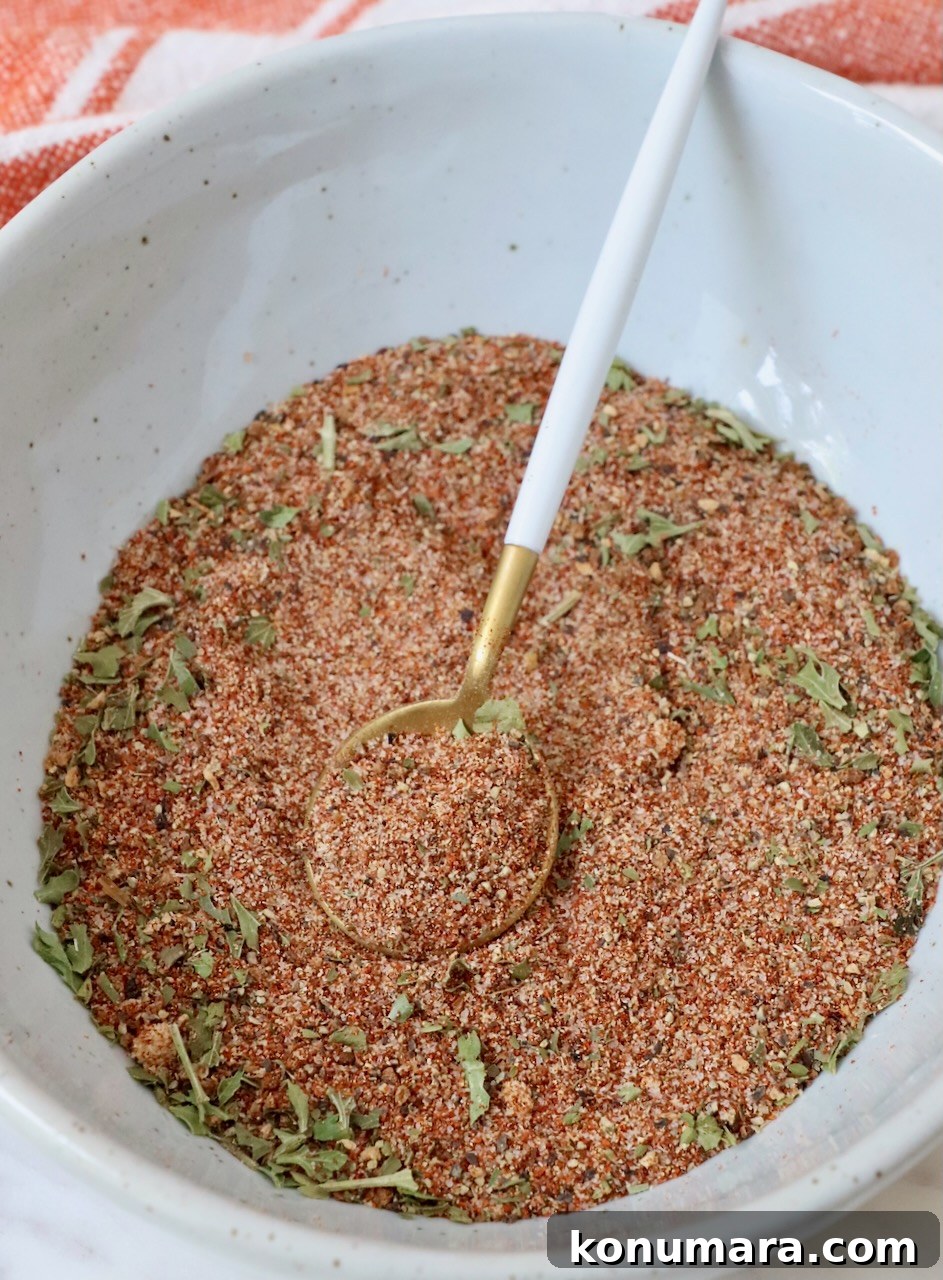 Citrus-Herb Salmon Seasoning for Grilling and Baking 4 salmon seasoning mixed together in a bowl with a spoon