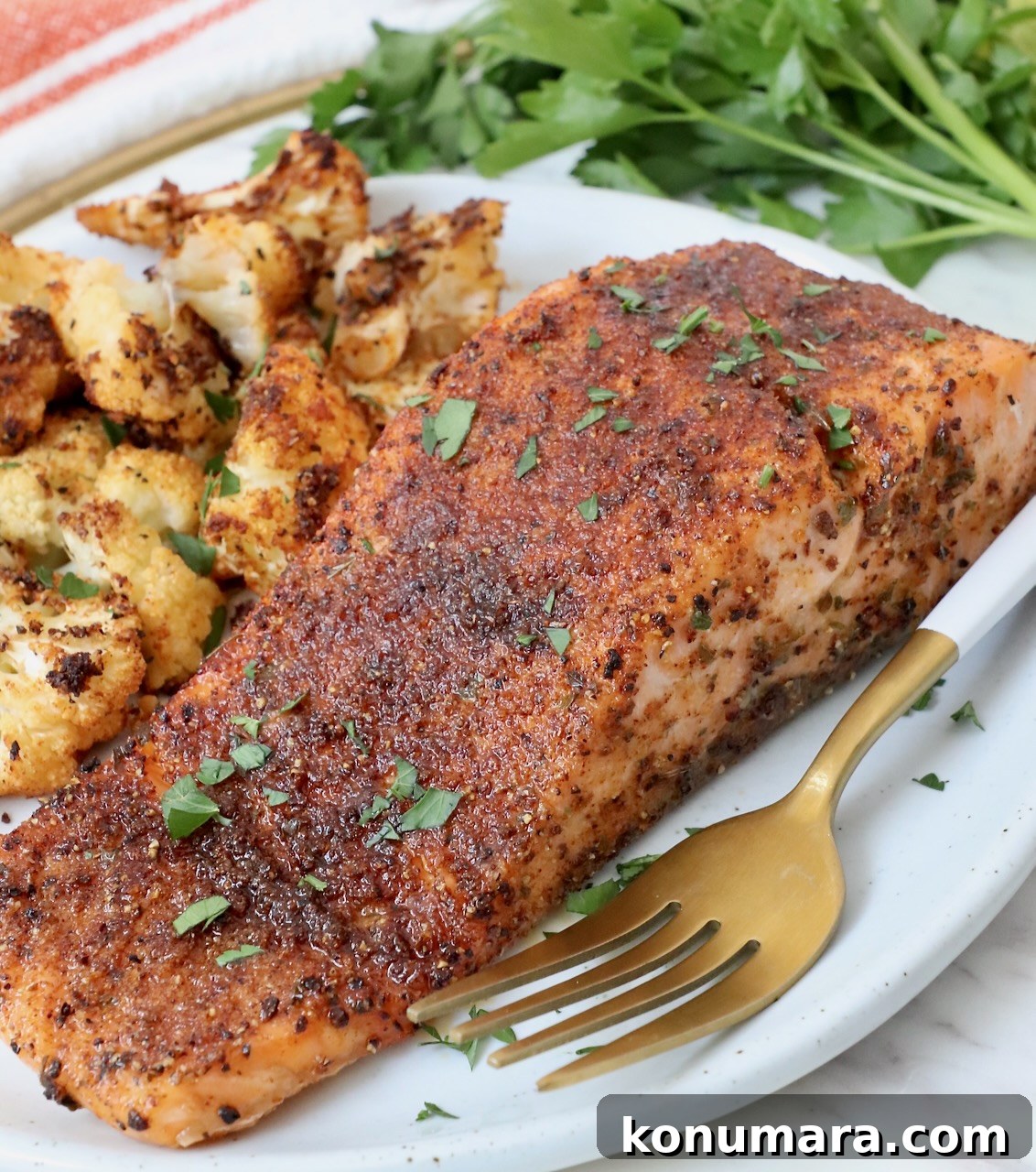 Citrus-Herb Salmon Seasoning for Grilling and Baking 5 cooked salmon filet on plate with fork and roasted cauliflower