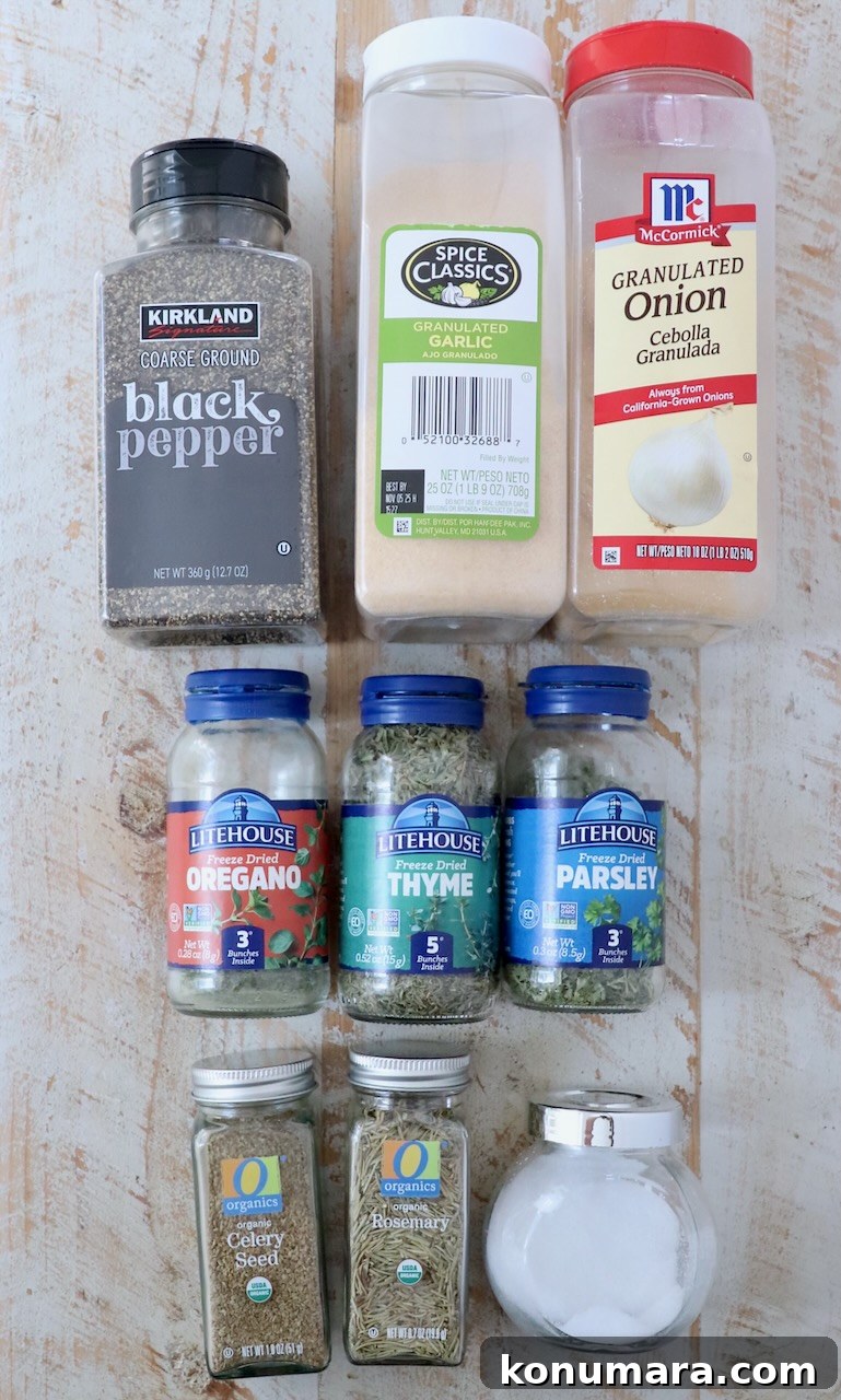 herbs and spices in jars on white wood board