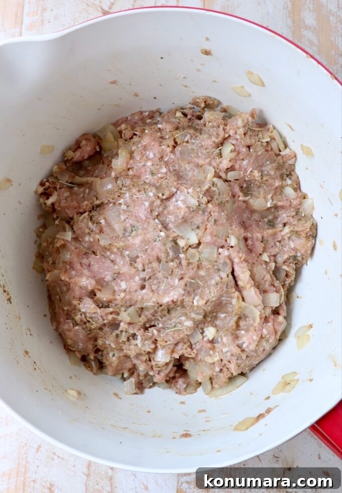 ingredients for turkey meatloaf mixed together in a large mixing bowl