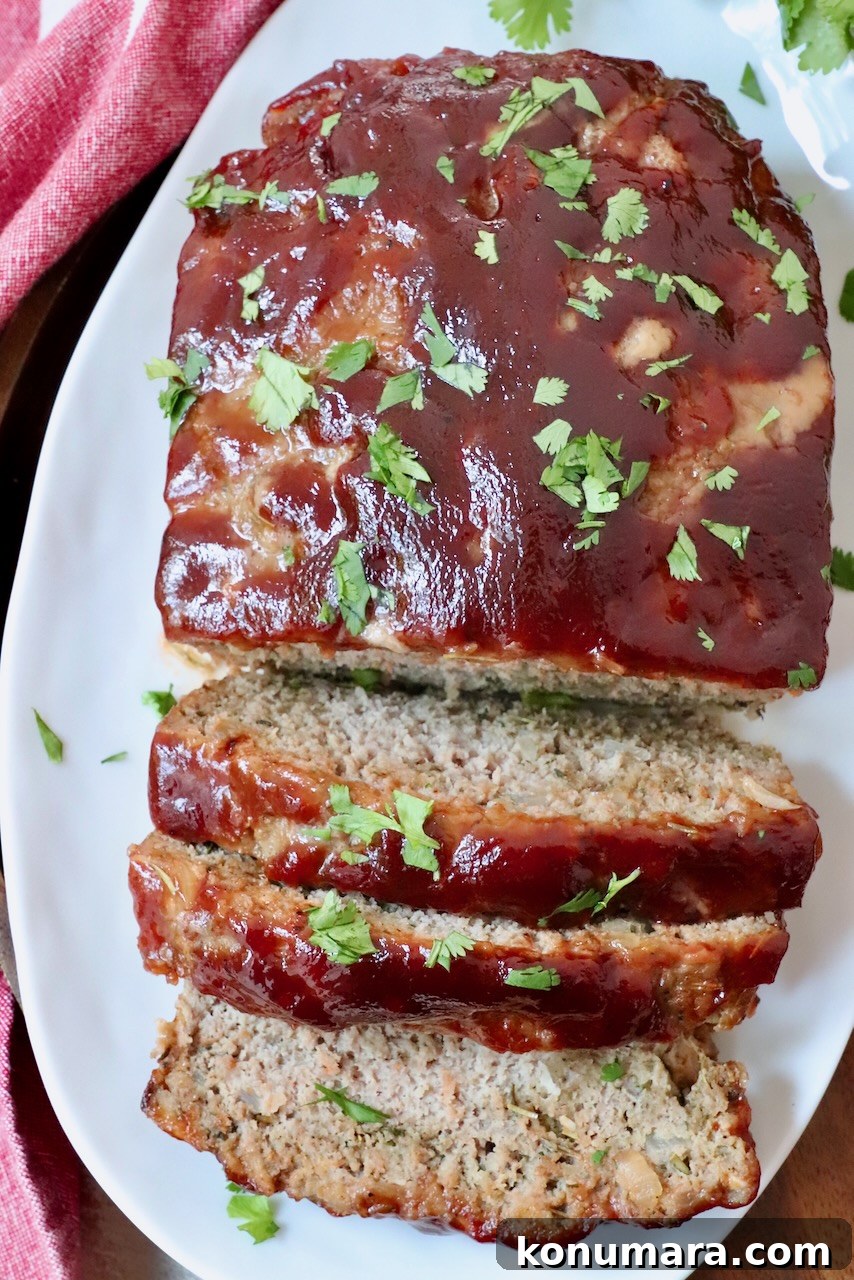 turkey meatloaf glazed with bbq sauce sliced on a plate