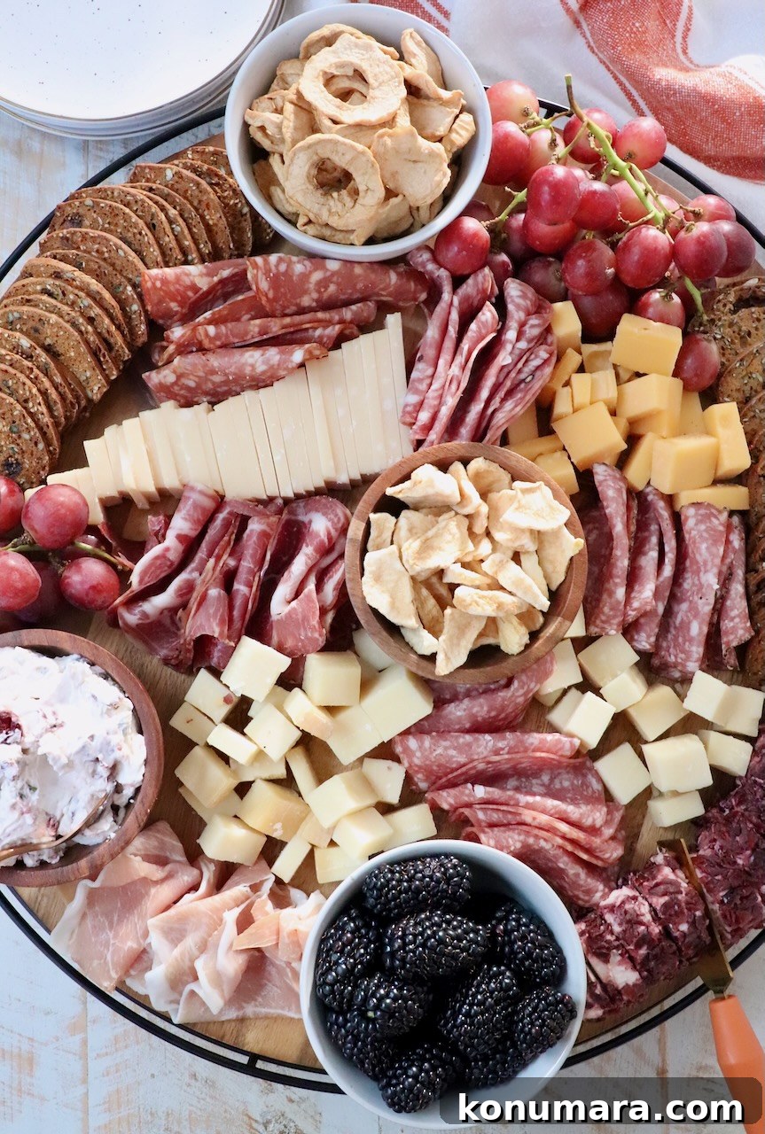 Cozy Fall Charcuterie Board with Seasonal Fruits and Cheese 2 charcuterie board with cured meats, cheeses, fruits and crackers