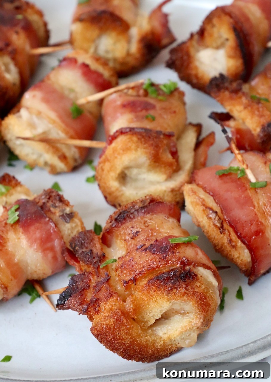 Crispy Bacon Roll Ups with Cream Cheese and Chives 9 bacon roll ups on a plate