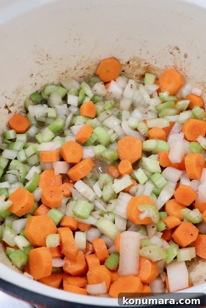 diced vegetables in a cast iron dutch oven