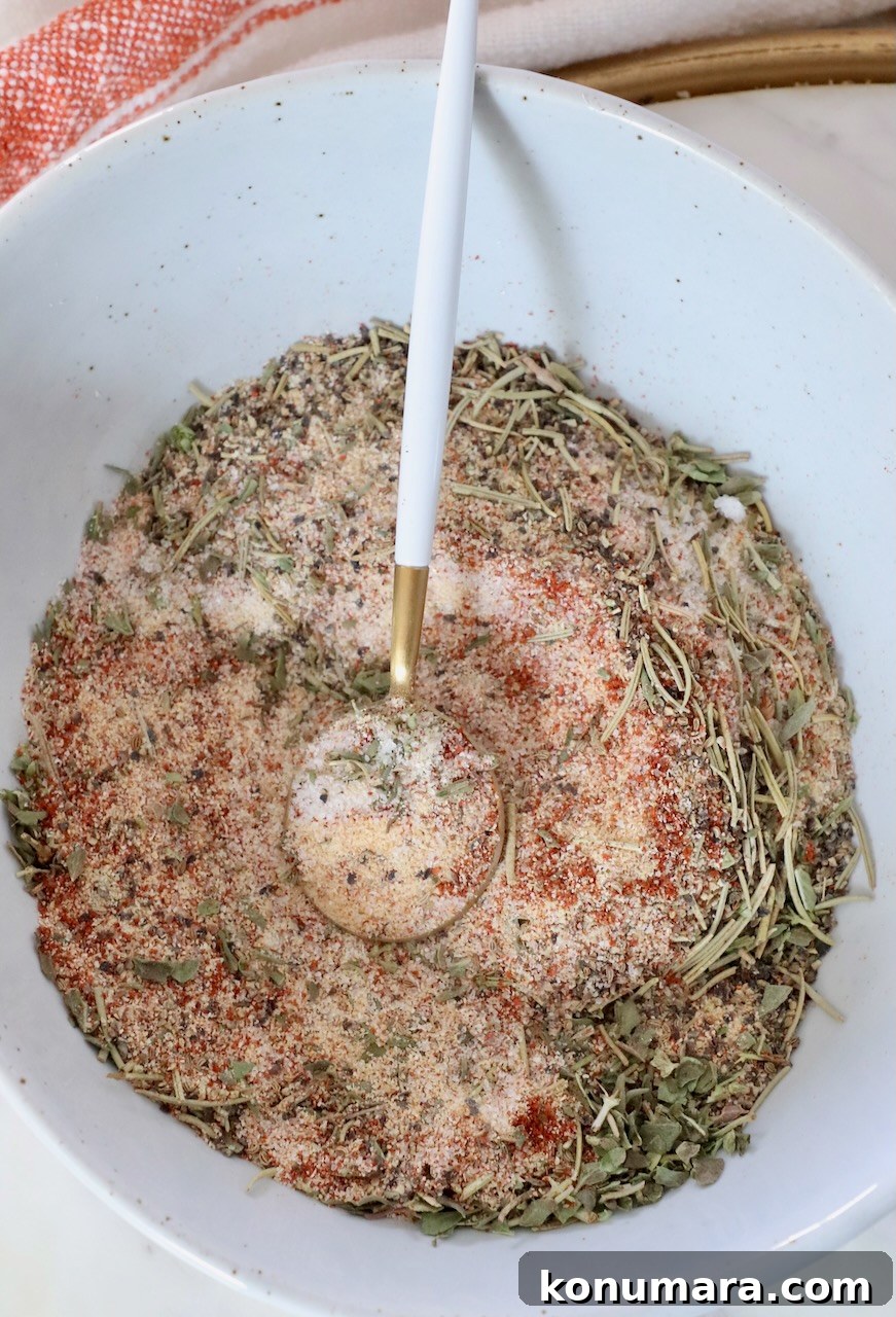 Homemade Beef Stew Seasoning for Rich Savory Flavor 5 dried herbs and spices mixed together in a bowl with a spoon