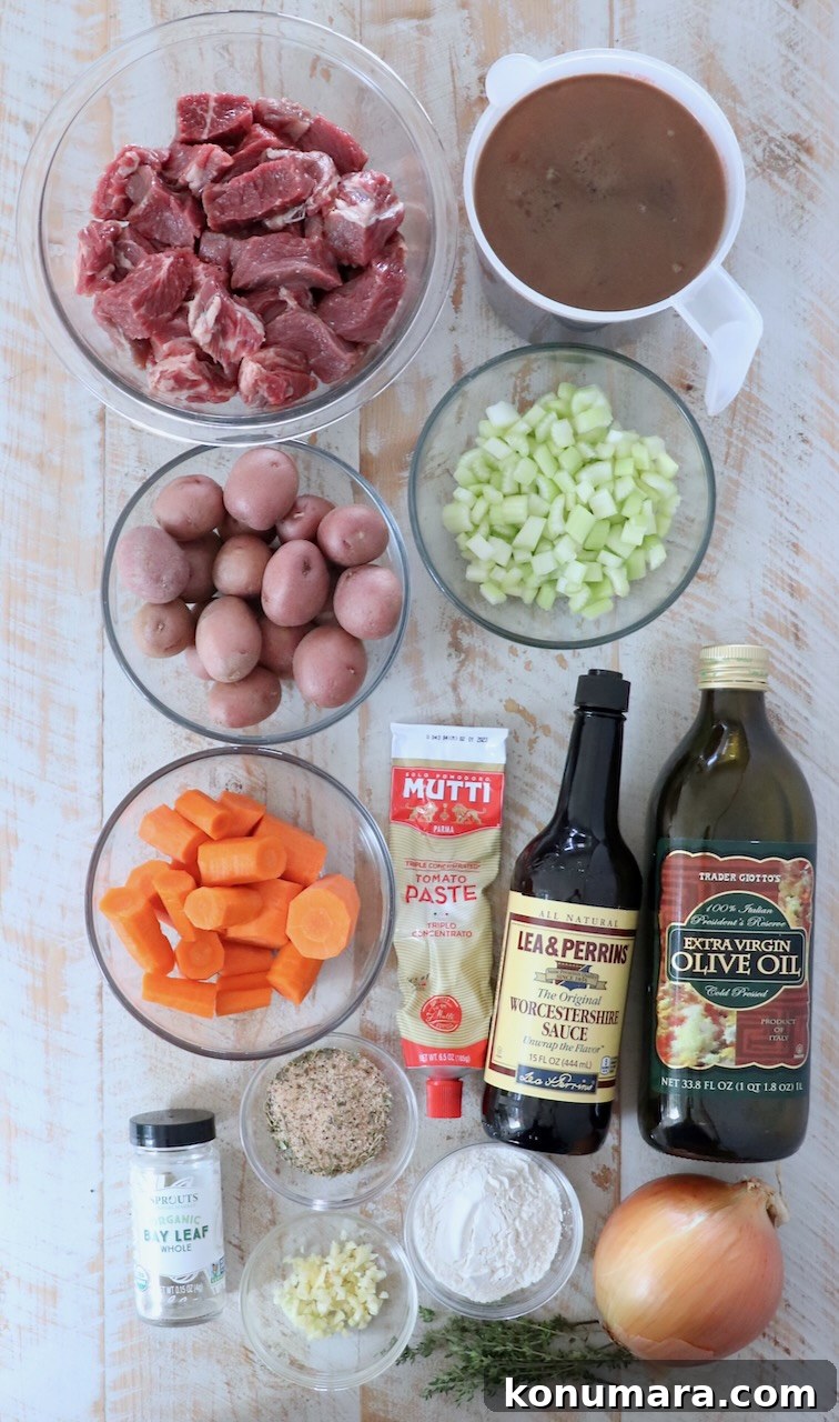 Comforting Slow-Cooked Beef Stew Recipe 3 ingredients in beef stew on a white wood board