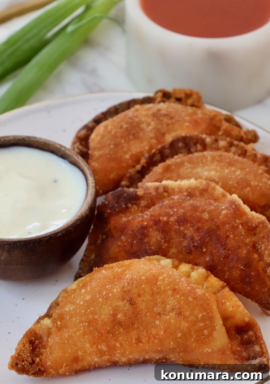 Crispy Buffalo Chicken Bites Recipe with Blue Cheese Dip 11 fried buffalo chicken bites on a plate