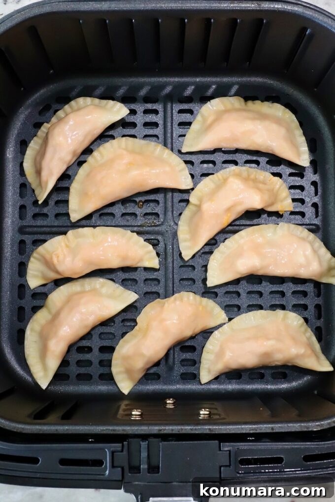 Crispy Buffalo Chicken Bites Recipe with Blue Cheese Dip 8 buffalo chicken bites in an air fryer basket