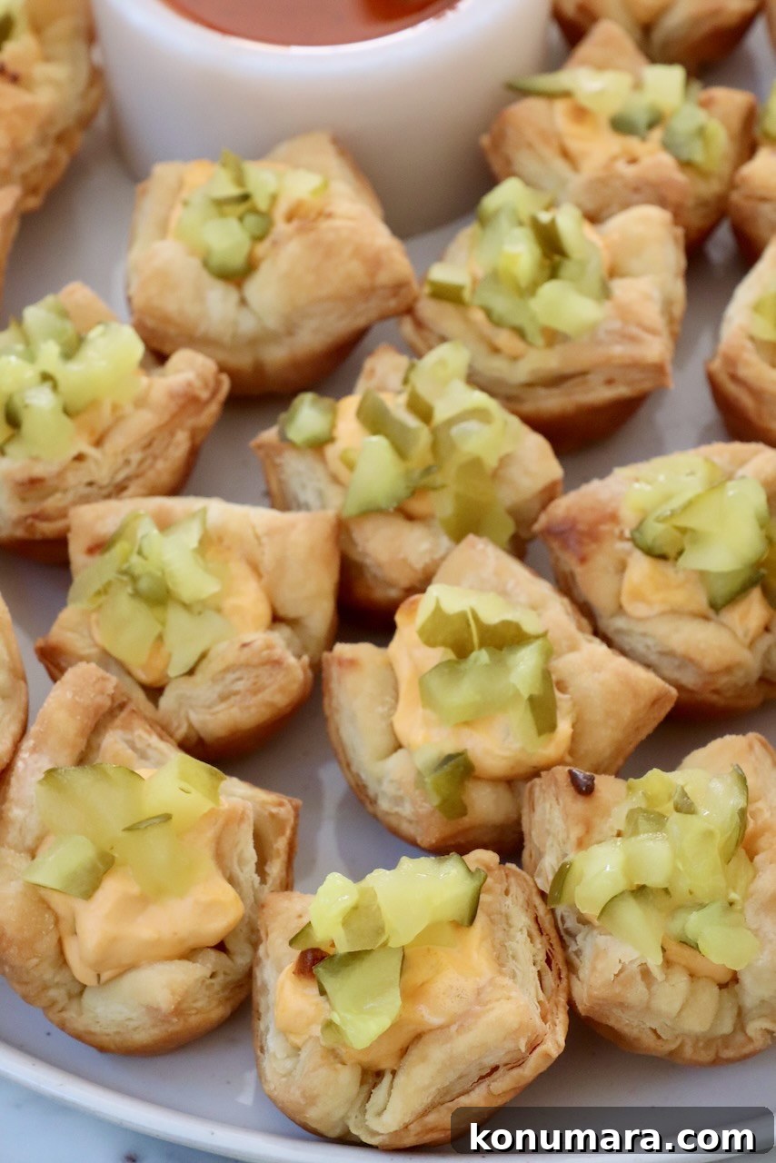 Crispy Puff Pastry Pickle Bites Recipe 7 puff pastry pickles bites on a plate