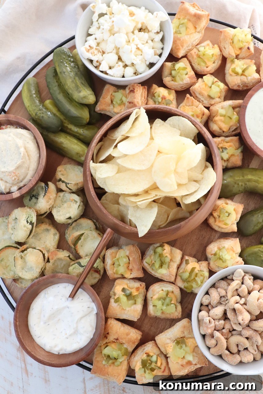How to Build an Irresistible Pickle Board 5 pickles and snacks on a large wood board