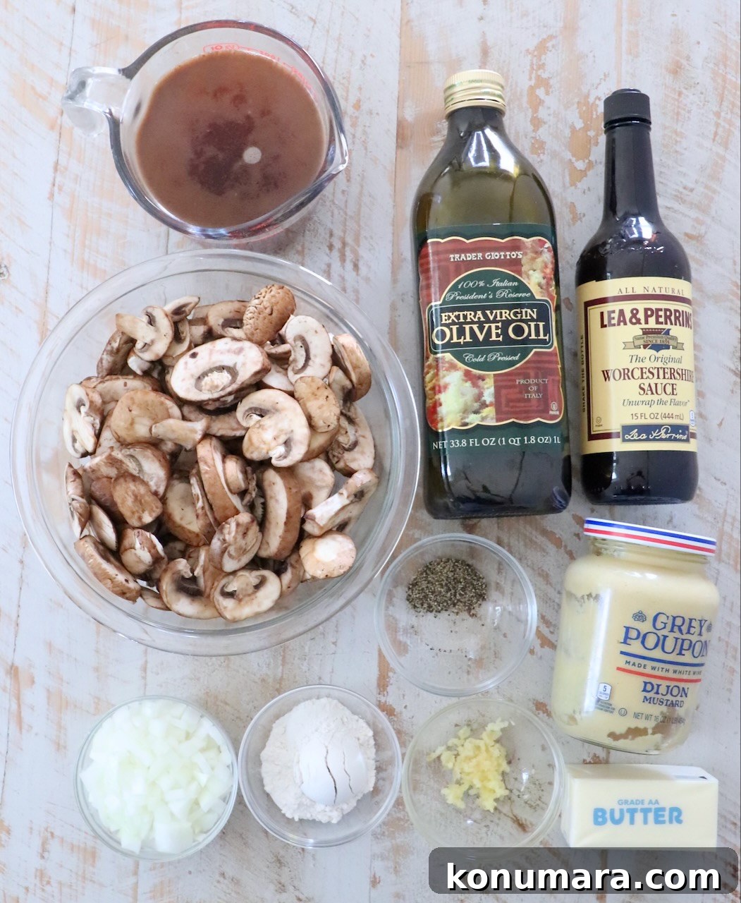 ingredients for mushroom gravy on a white wood board