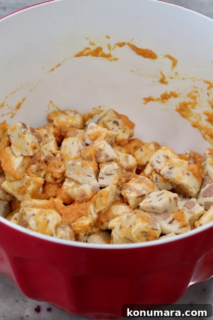Maple-Glazed Pull-Apart Pumpkin Cinnamon Rolls 6 cubed cinnamon rolls tossed with pumpkin puree in a mixing bowl