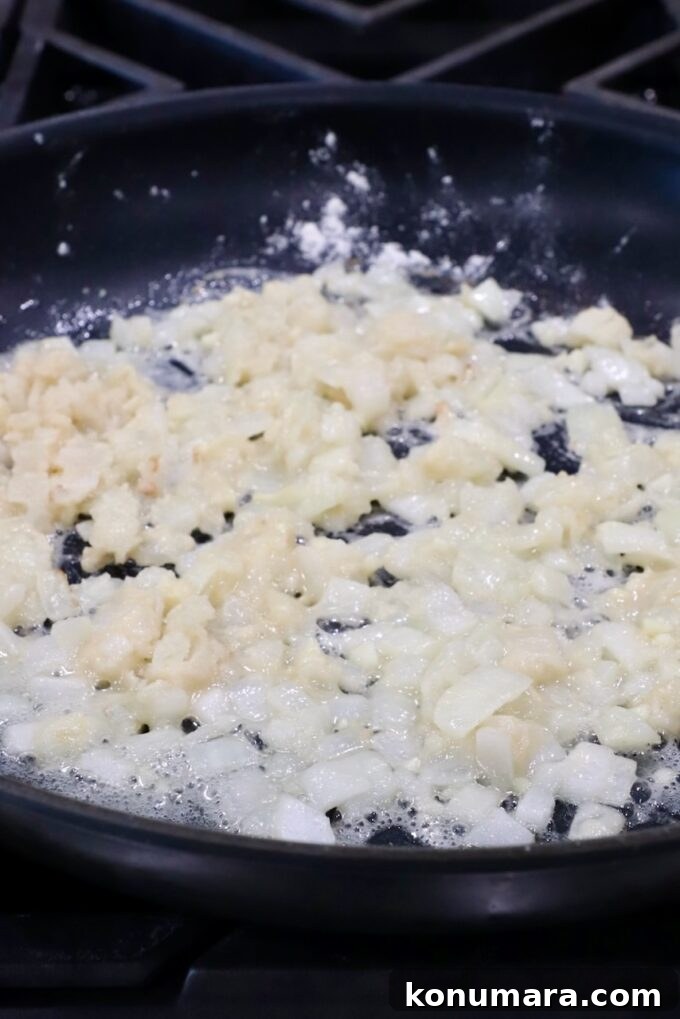 Creamy Au Gratin Potatoes Recipe 5 diced onions and garlic in a skillet with flour
