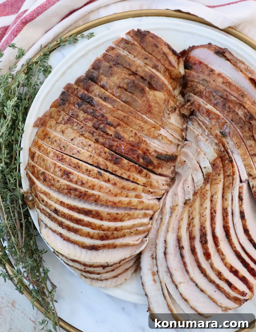 Smoked Turkey Recipe for Thanksgiving: Juicy, Crispy Skin 2 smoked turkey breasts sliced on a plate