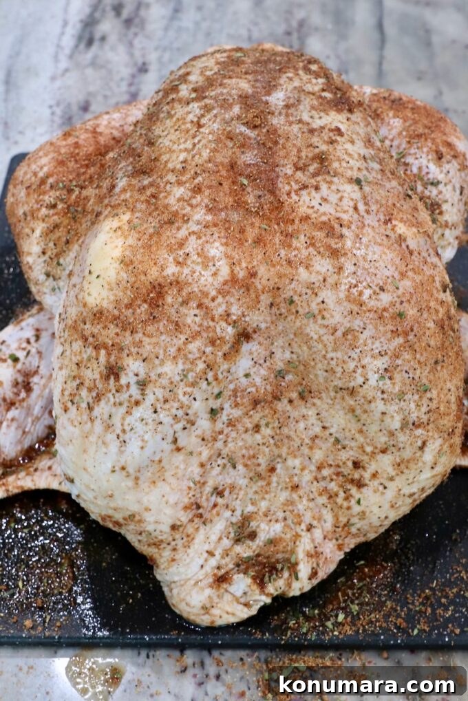 Smoked Turkey Recipe for Thanksgiving: Juicy, Crispy Skin 4 seasoned turkey on a cutting board