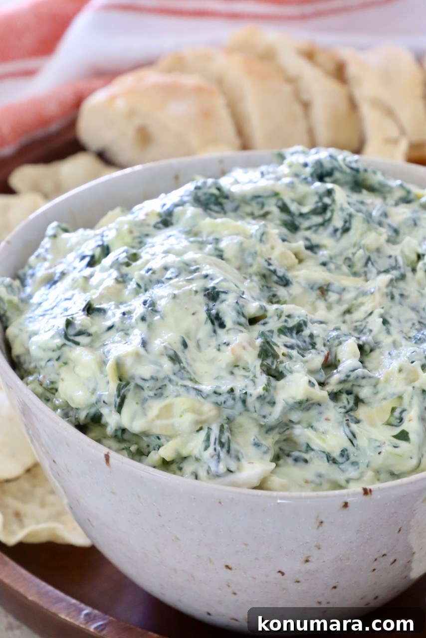 Creamy Baked Spinach and Artichoke Dip Recipe 9 spinach artichoke dip in a bowl
