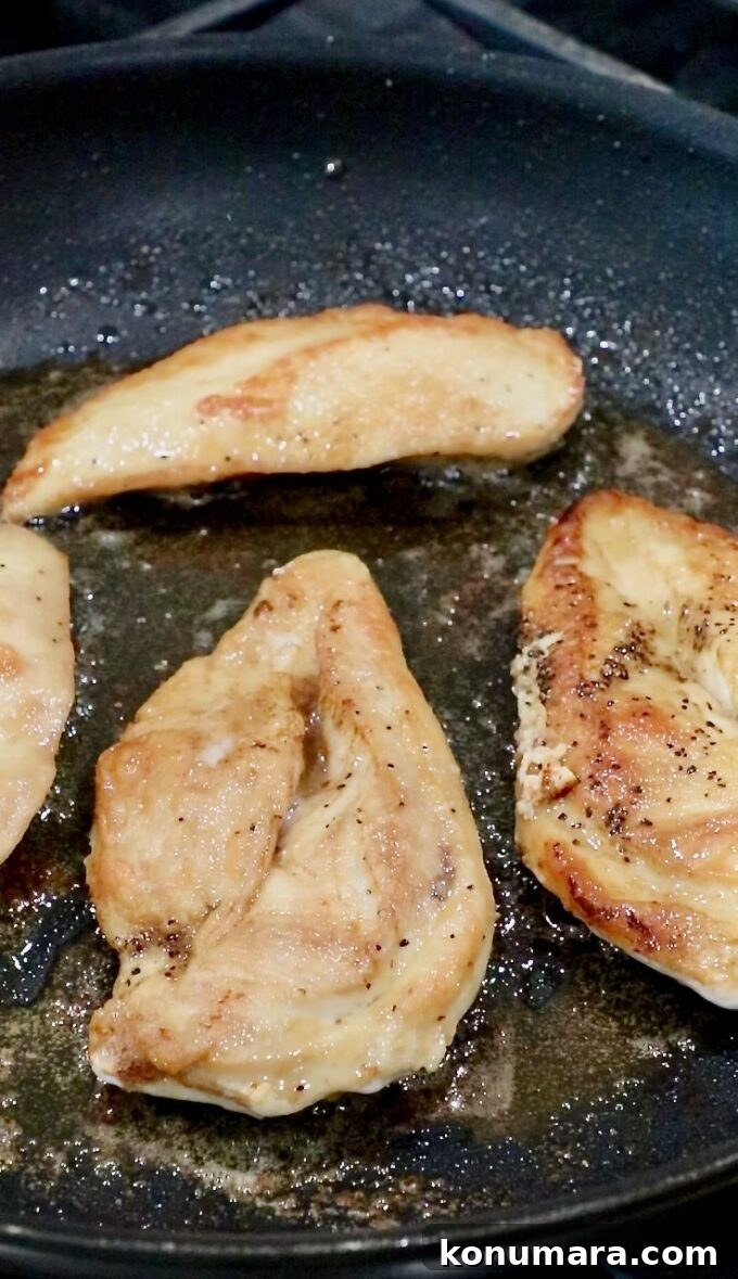cooked chicken breasts in a skillet