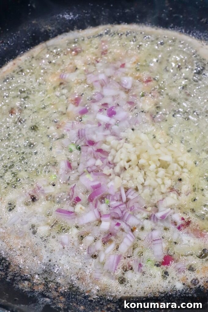 diced shallots and garlic in a skillet with melted butter