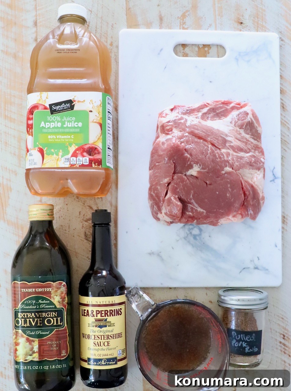 Slow-Cooker BBQ Pulled Pork Recipe 3 ingredients for pulled pork on a white wood board