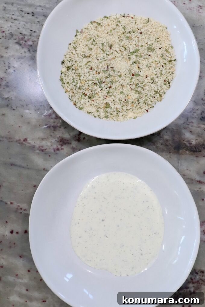 ranch dressing in bowl, next to seasoned breadcrumbs in a bowl