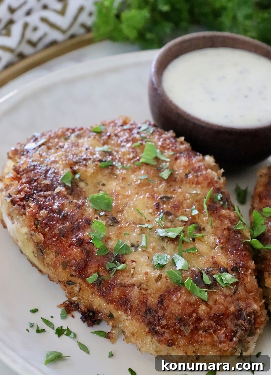 pan fried breaded pork chop on a plate