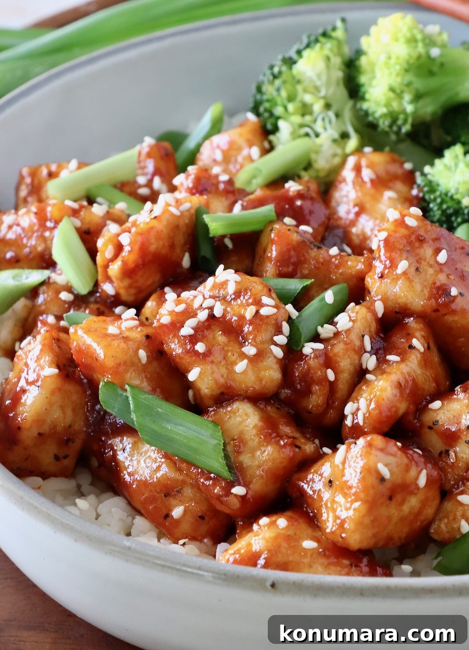 Korean Gochujang Chicken Recipe 2 Prepared Gochujang Chicken in a bowl with broccoli and rice