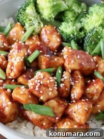 Gochujang Chicken in a bowl with rice and broccoli