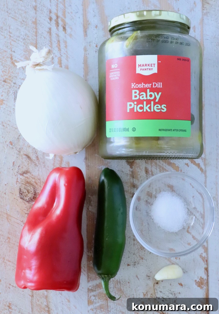 ingredients for pickle de gallo on a white wood board