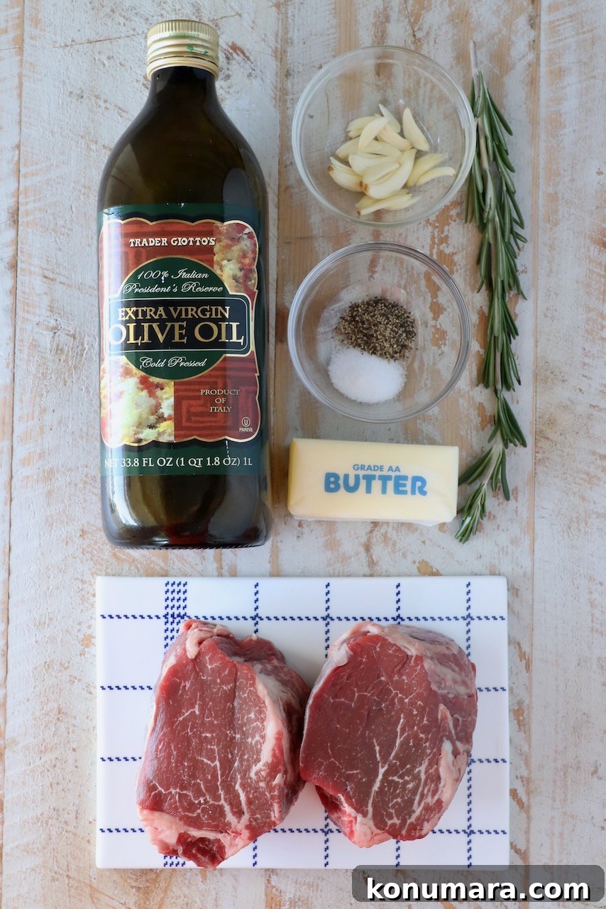 ingredients for filet mignon on a white wood board