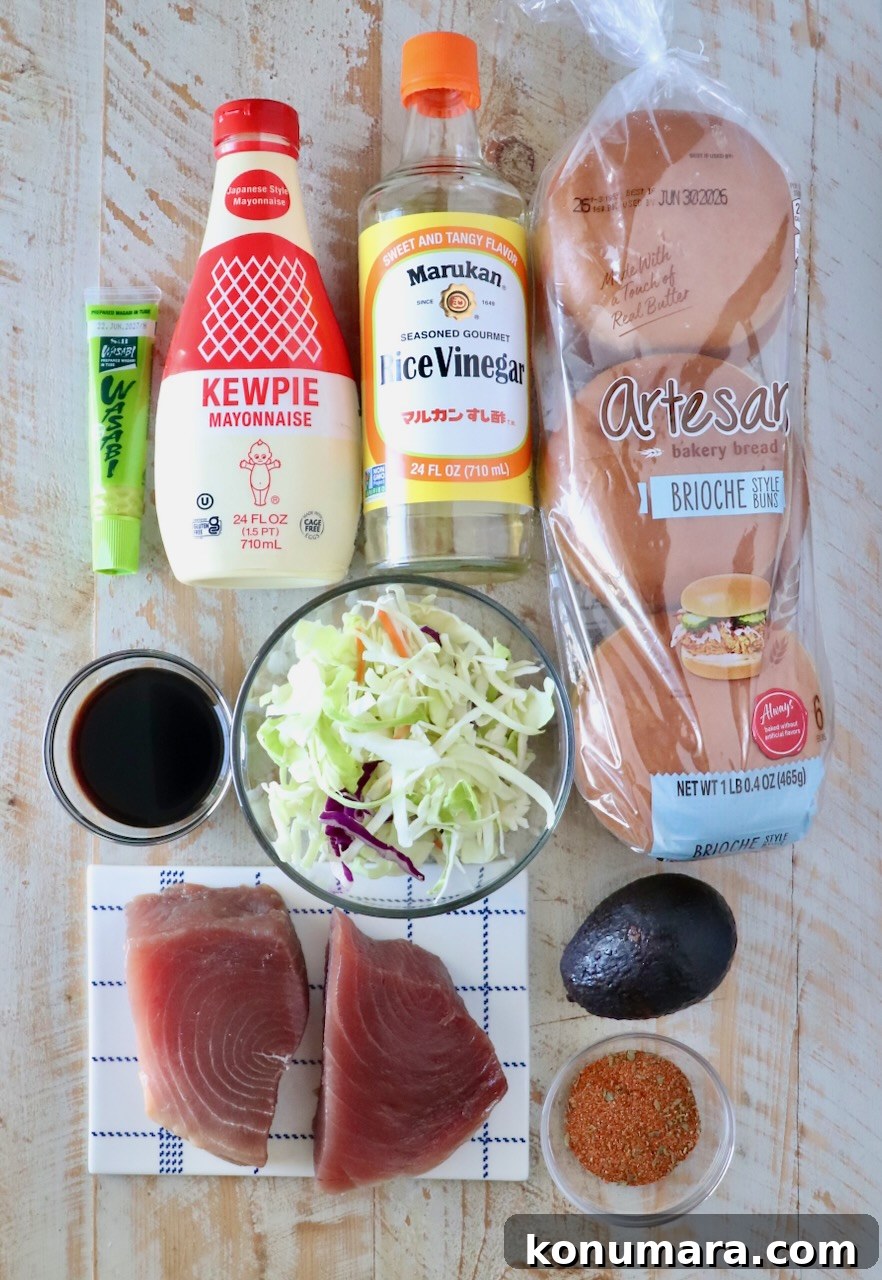 ingredients for ahi tuna burger laid out on a white wood board