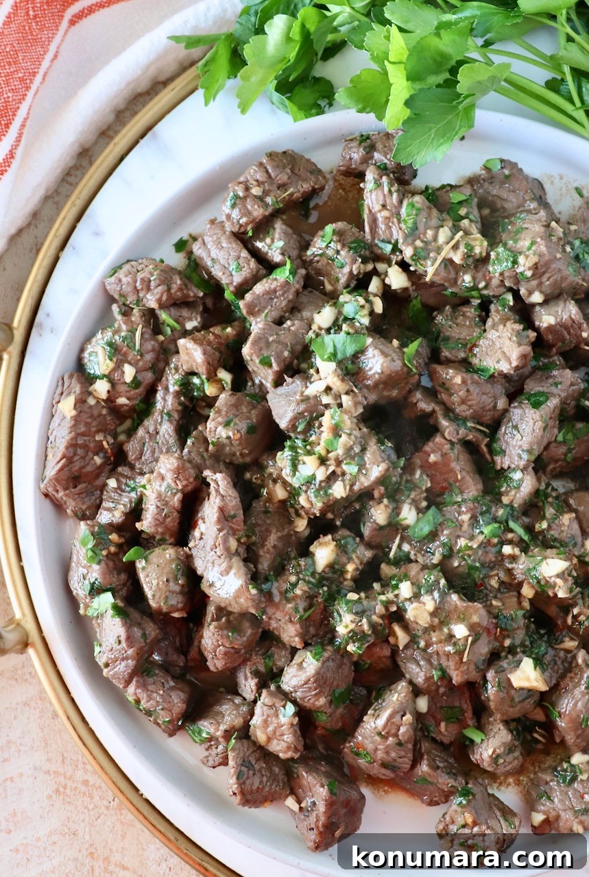 Garlic Butter Steak Bites Recipe: Juicy Pan-Seared Bites 10 cooked steak bites piled up on a plate