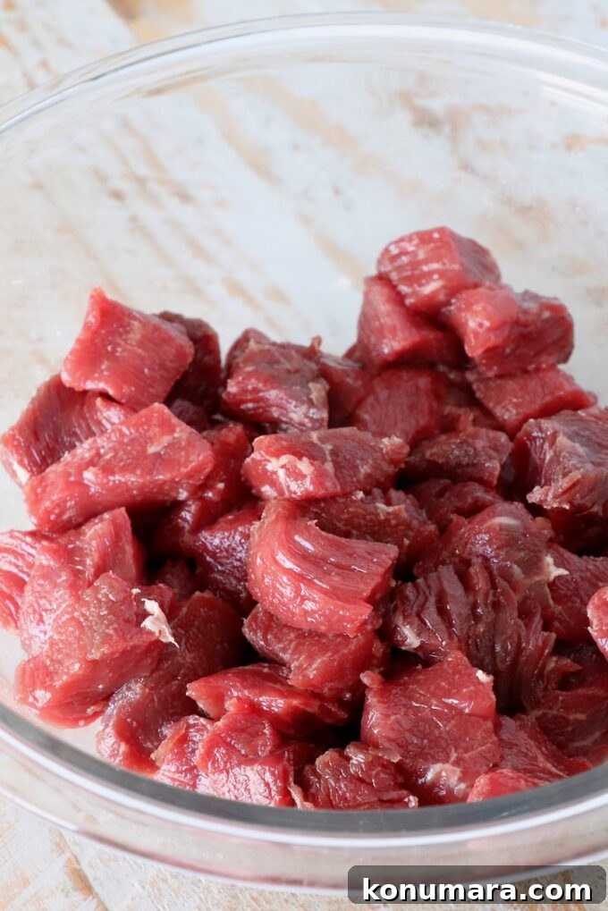 Garlic Butter Steak Bites Recipe: Juicy Pan-Seared Bites 5 cubes of steak in a glass bowl