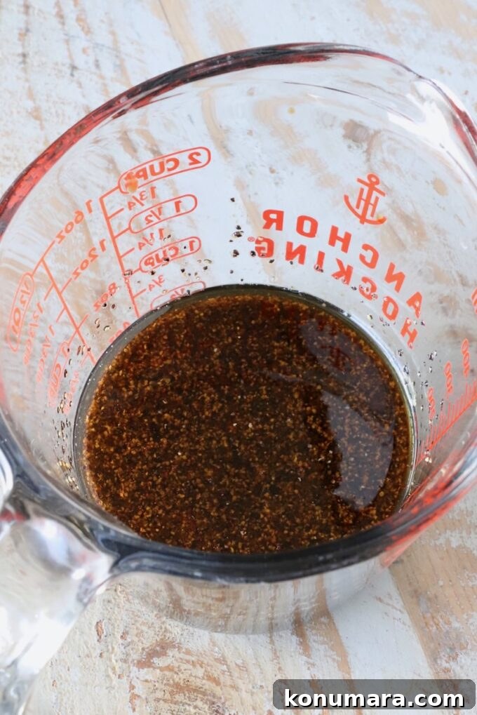 Pepper Steak Stir-Fry Recipe with Bell Peppers 5 black pepper sauce in a glass measuring cup
