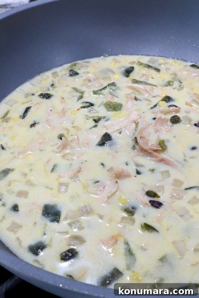 creamy chicken poblano soup in a large pot