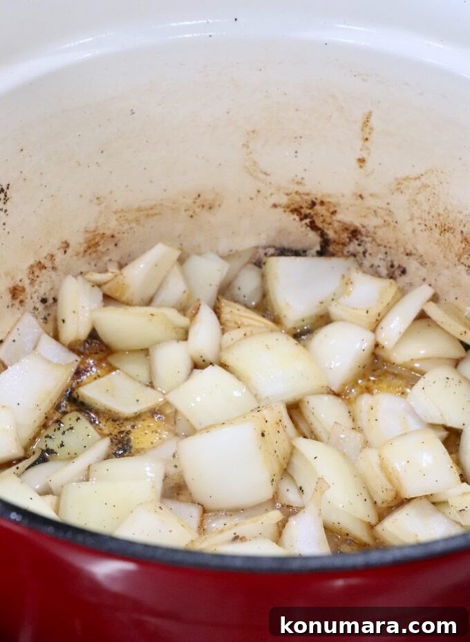 large diced onions in a large cast iron pot