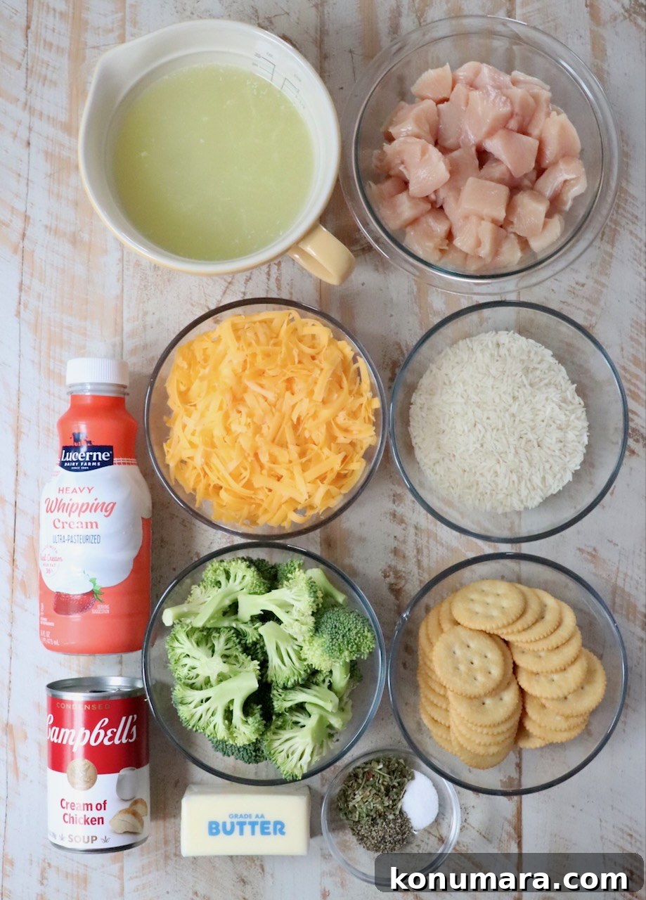 ingredients for chicken broccoli rice casserole on a white wood board