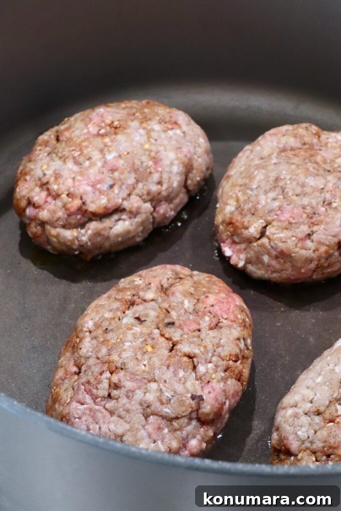 How to Make Chopped Steak with Mushroom Gravy 5 uncooked ground beef patties in a large dutch oven on the stove
