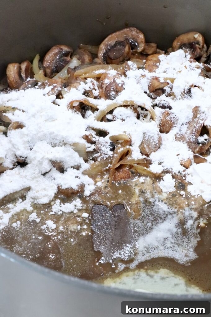 How to Make Chopped Steak with Mushroom Gravy 10 sliced mushrooms and onions in a pot with melted butter and flour