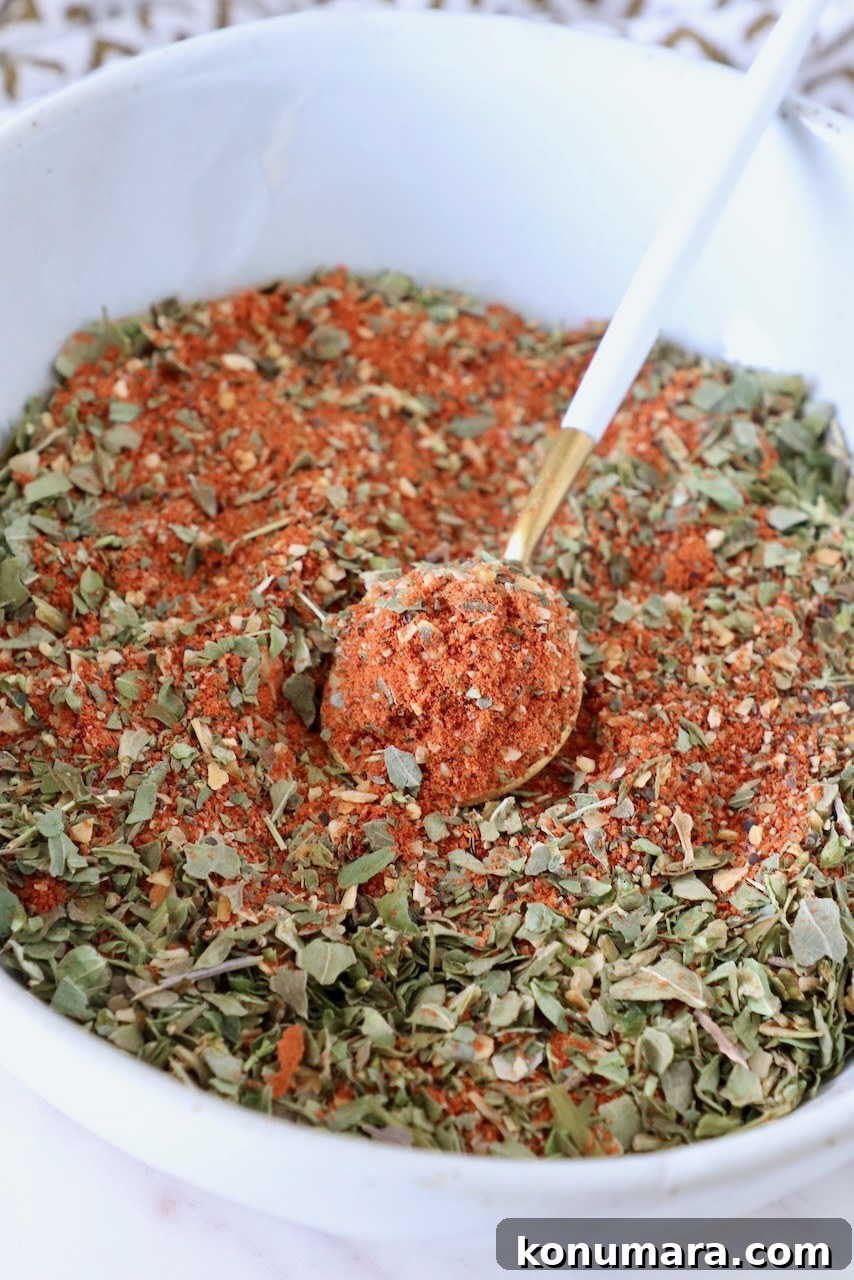 pizza seasoning in a bowl with a small spoon