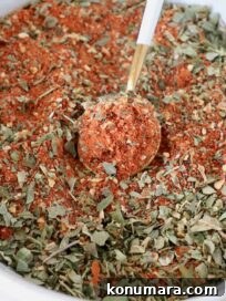 pizza seasoning in a bowl with a spoon